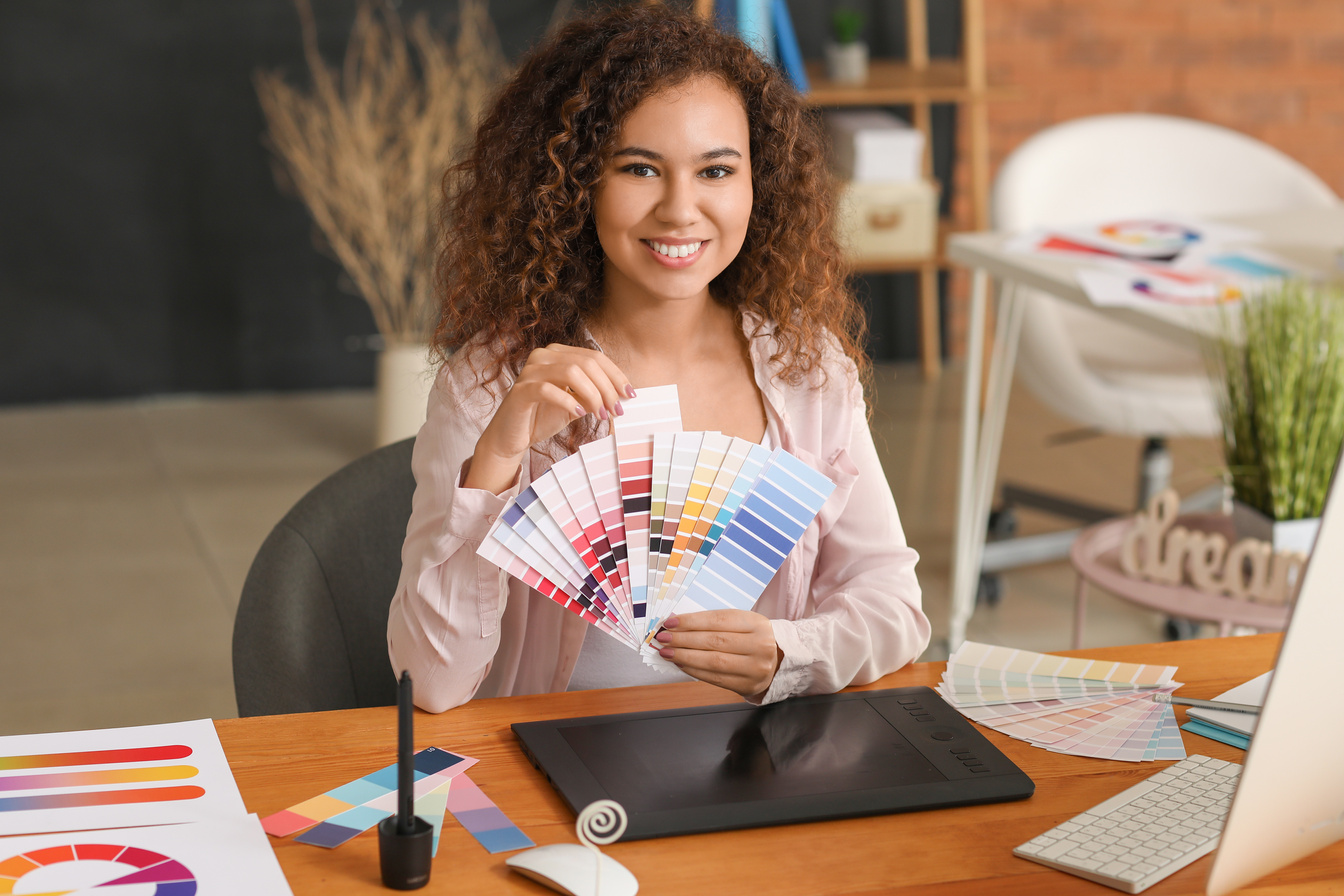 African-American Designer with Color Palettes in Office